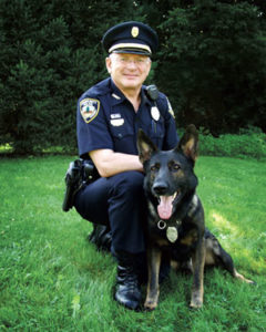 Shelburne Police Department’s Chris Morrell, at 72-years-old, along with his 12-year-old canine partner Buck, has retired—after achieving recognition as the oldest police dog handler in the United States. (Courtesy photo)