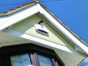 An external alarm bell box mounted on a house is an audio/visual deterrent to home invaders. Flashing lights alert intruders that the system is working; an audible alarm sounds if an internal alarm is triggered. (Photo courtesy of Harri Healey)