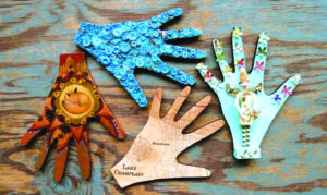 Gorgeous decorated hands are showcased once again at the 4th Annual 'Shop of HANDS' exhibition and silent auction through March at Penny Cluse Cafe in Burlington. Profits go toward HANDS, a local non-profit striving to close gaps in getting food to older Vermonters (Contributed Photo)
